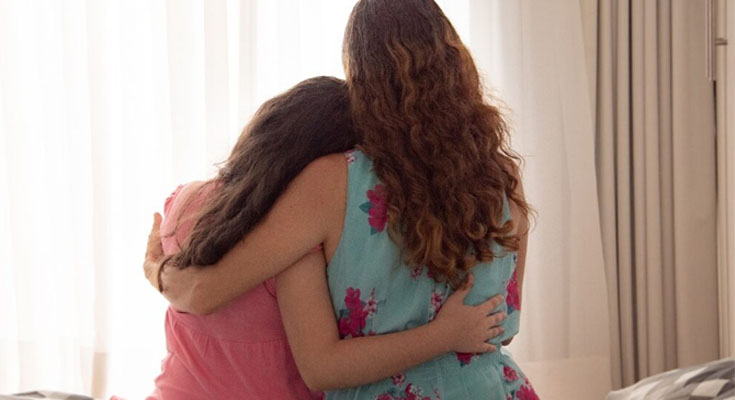 Mother sparks fury after telling daughter to stop cuddling her